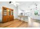 Bright kitchen with white cabinets, granite countertops, stainless steel appliances, and breakfast bar with seating at 1725 Pine Ridge E Way # E, Palm Harbor, FL 34684