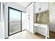 Bright office nook featuring a sliding glass door, built-in white cabinetry, and granite countertops at 1725 Pine Ridge E Way # E, Palm Harbor, FL 34684