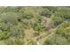 Secluded property with mature trees, partial fencing, and lush greenery at 18110 30Th St, Lutz, FL 33559