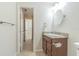 Bathroom with granite counters, stylish fixtures, and neutral tiling at 18110 30Th St, Lutz, FL 33559