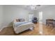 Bedroom with hardwood floors, a ceiling fan, and ensuite bathroom at 18110 30Th St, Lutz, FL 33559