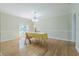The dining room, featuring hardwood flooring and natural light that streams in from the large window at 18110 30Th St, Lutz, FL 33559