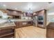 Elegant kitchen with granite countertops, stainless steel appliances, custom cabinets, and hardwood flooring at 18110 30Th St, Lutz, FL 33559
