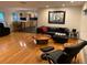 Bright living room with hardwood floors, modern furniture, and an open floor plan at 1861 Harmony Dr, Clearwater, FL 33756