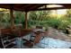 Pergola-covered patio features outdoor seating and landscaping at 1861 Harmony Dr, Clearwater, FL 33756