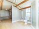 Bathroom featuring a walk-in shower, toilet, and shelving at 1912 E 97Th Ave, Tampa, FL 33612