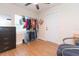 Bright bedroom with wood floors, window, closet space, and a closet alternative for optimal storage at 1912 E 97Th Ave, Tampa, FL 33612