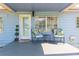 Welcoming front porch with seating area and stylish decor at 1912 E 97Th Ave, Tampa, FL 33612
