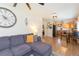 Open-concept living room with stylish furnishings and a view into the kitchen at 1912 E 97Th Ave, Tampa, FL 33612