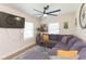 Inviting living room featuring a plush sectional sofa and modern décor at 1912 E 97Th Ave, Tampa, FL 33612