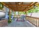 Outdoor patio area with furniture, plants, and string lights at 1912 E 97Th Ave, Tampa, FL 33612