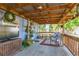 Outdoor patio area with furniture, plants, and string lights at 1912 E 97Th Ave, Tampa, FL 33612