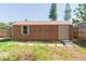 Exterior view of shed featuring wood siding, steps to entry, and window at 1912 E 97Th Ave, Tampa, FL 33612