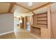 Interior of shed featuring wood-look flooring, shelving, and built-in cabinets at 1912 E 97Th Ave, Tampa, FL 33612