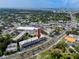 Aerial view of a condominium building featuring mature trees, landscaping, and parking at 211 Pasadena N Ave # 109, St Petersburg, FL 33710