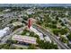 Aerial view of a condominium building with mature landscaping and a parking lot at 211 Pasadena N Ave # 109, St Petersburg, FL 33710