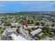 Real estate view showcases community nestled among trees with surrounding businesses at 211 Pasadena N Ave # 109, St Petersburg, FL 33710