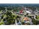 Aerial view of a condominium building in a neighborhood with mature trees and landscaping at 211 Pasadena N Ave # 109, St Petersburg, FL 33710