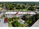 Aerial shot showcases community setting with lush greenery and mature trees at 211 Pasadena N Ave # 109, St Petersburg, FL 33710
