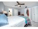 Bedroom featuring a ceiling fan, closet, neutral walls and en-suite bathroom at 211 Pasadena N Ave # 109, St Petersburg, FL 33710