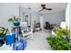 Bright bedroom, featuring white wood flooring, a ceiling fan, and natural light at 211 Pasadena N Ave # 109, St Petersburg, FL 33710