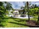 Charming courtyard featuring cozy seating and lush greenery near condo building at 211 Pasadena N Ave # 109, St Petersburg, FL 33710