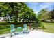 Well-manicured common outdoor area with grill and chairs for gatherings at 211 Pasadena N Ave # 109, St Petersburg, FL 33710