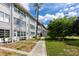 Charming condominium showcases lush greenery and a well-maintained walkway at 211 Pasadena N Ave # 109, St Petersburg, FL 33710