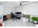 Home office with wood-look floors, ceiling fan and a large picture window at 211 Pasadena N Ave # 109, St Petersburg, FL 33710