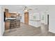 Open kitchen with stainless steel appliances, ample counter space, and a breakfast bar at 2325 W Knollwood Pl, Tampa, FL 33604
