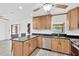 Modern kitchen featuring granite countertops, updated appliances, and sleek cabinetry at 2325 W Knollwood Pl, Tampa, FL 33604