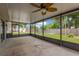 The screened-in porch overlooks the backyard and has ample space for entertaining guests at 2325 W Knollwood Pl, Tampa, FL 33604