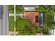 Aerial view of the property showcasing the tile roof, pool with enclosure, solar panels, and the landscaped yard at 267 Snell Isle Ne Blvd, St Petersburg, FL 33704