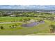 Beautiful aerial view of a golf course with lush green fairways, mature trees, and serene water hazards at 267 Snell Isle Ne Blvd, St Petersburg, FL 33704