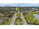Expansive aerial view of a neighborhood with well-maintained streets and lush landscaping near a golf course at 267 Snell Isle Ne Blvd, St Petersburg, FL 33704