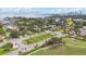 Scenic aerial view of a neighborhood featuring tree-lined streets and meticulously landscaped properties near the water at 267 Snell Isle Ne Blvd, St Petersburg, FL 33704