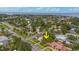 Aerial view of home and surrounding neighborhood, showcasing lush greenery, proximity to water and cityscape at 267 Snell Isle Ne Blvd, St Petersburg, FL 33704