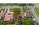 Aerial view of the property featuring the tile roof, enclosed pool, and landscaping in a residential neighborhood setting at 267 Snell Isle Ne Blvd, St Petersburg, FL 33704