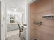 Bathroom features double sinks with granite countertop plus separate vanity and shelved closet at 2708 W Bird St, Tampa, FL 33614