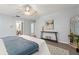Bedroom with light blue walls, wood floors, and a ceiling fan with a bonus living area at 2708 W Bird St, Tampa, FL 33614
