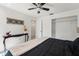 Bedroom with minimalist design featuring a large bed and a console table with decor at 2708 W Bird St, Tampa, FL 33614