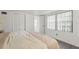 Bright bedroom features two closets, large window, and wood-look floors at 2708 W Bird St, Tampa, FL 33614