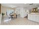 Dining area with tile flooring, modern lighting, dining table and access to living room and kitchen at 2708 W Bird St, Tampa, FL 33614