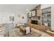 Cozy living area showcasing a stone fireplace with built-in shelving, complemented by elegant decor at 2708 W Bird St, Tampa, FL 33614