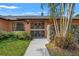A well-maintained walkway leads to the charming front door and stone entryway of the home at 2708 W Bird St, Tampa, FL 33614