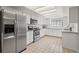 Bright kitchen featuring stainless steel appliances, light granite countertops and white subway tile backsplash at 2708 W Bird St, Tampa, FL 33614