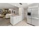 Open kitchen with a granite topped island, stainless steel appliances, and an open floor plan at 2708 W Bird St, Tampa, FL 33614