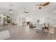 Spacious living room with modern flooring, vaulted ceilings, and a mirrored wall reflecting the fireplace at 2708 W Bird St, Tampa, FL 33614