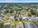 Aerial view of the residential neighborhood with mature trees, lawns, and a variety of home styles at 2708 W Bird St, Tampa, FL 33614