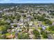 Aerial view of a residential area with tree-lined streets and various houses and businesses at 2708 W Bird St, Tampa, FL 33614
